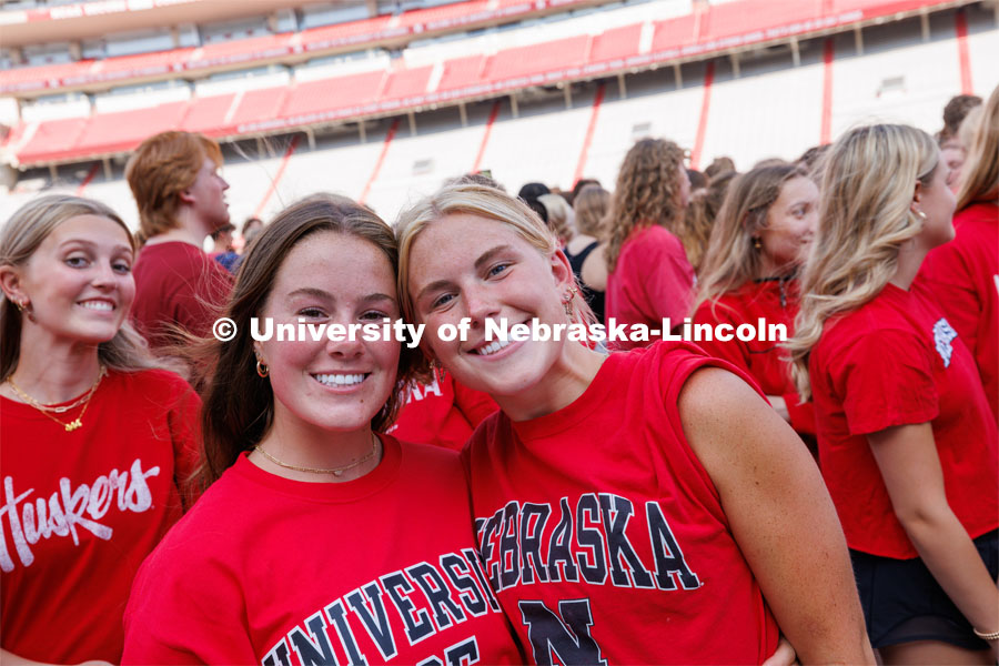 Students pose for a photo at the Tunnel Walk in Memorial Stadium. August 18, 2023. Photo by Craig Chandler / University Communication.