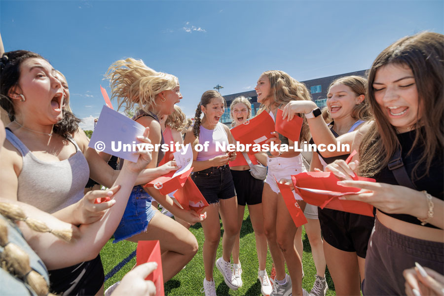 New sorority members react as they open their bid cards Saturday. Sorority Bid Day in the Cather Dining Complex and on the Vine Street Fields. August 19, 2023. Photo by Craig Chandler / University Communication.