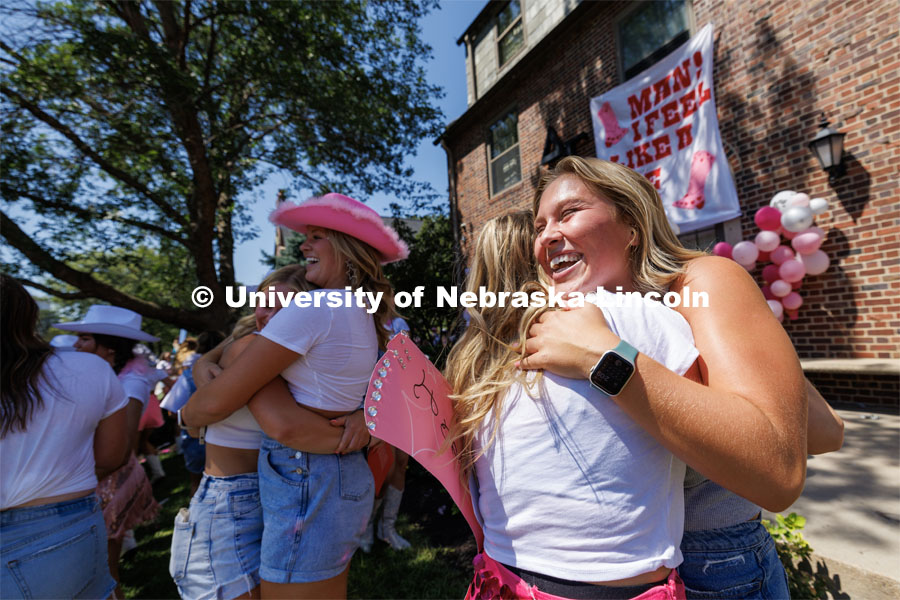 Hugs outside Delta Gamma sorority. Sorority Bid Day in the Cather Dining Complex and on the Vine Street Fields. August 19, 2023. Photo by Craig Chandler / University Communication.