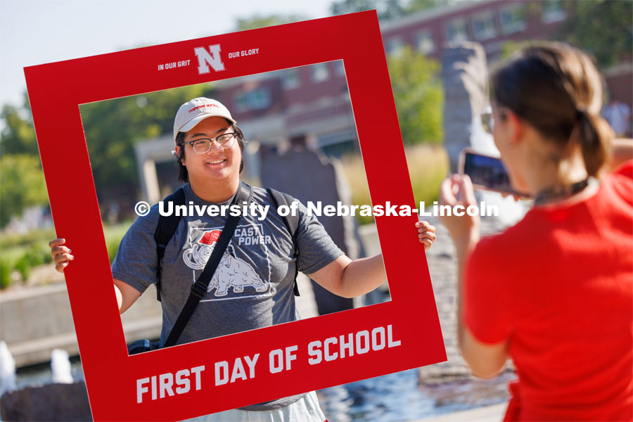 Students take advantage of a first day of school photo op outside the Nebraska Union. First day of classes for fall semester. August 21, 2023. Photo by Craig Chandler / University Communication.