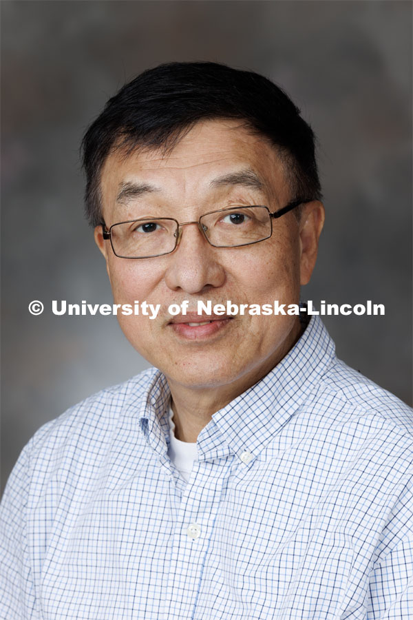 Studio portrait of Joe Zhou, Research Professor, Center for Biotechnology. September 14, 2023. Photo by Craig Chandler / University Communication.