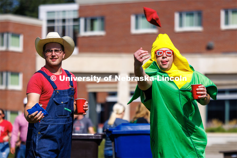 Sean Cuthbert, tosses a bag as he and Mitchel Brever, play corn hole at the Student Tailgate in the greenspace north of the Nebraska Union. Nebraska vs. Northern Illinois football in Memorial Stadium. September 16, 2023. Photo by Craig Chandler / University Communication.