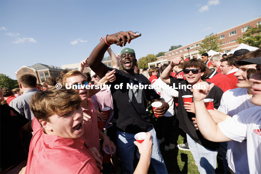 Students dance to the music coming from one of the tents at the Student Tailgate in the greenspace north of the Nebraska Union. Northern Illinois football in Memorial Stadium. September 16, 2023. Photo by Craig Chandler / University Communication.