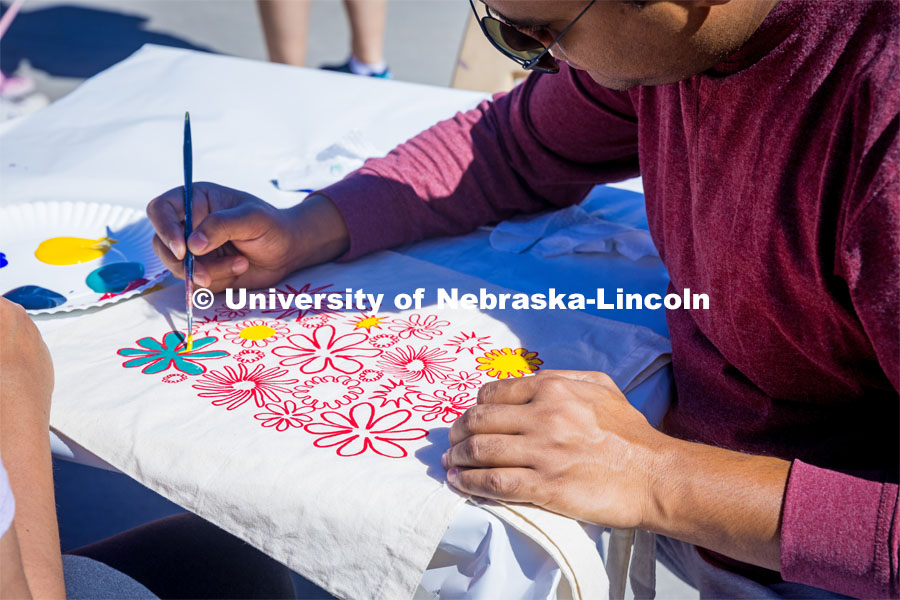Painting tote bags at the Lux Street Art Festival. About Lincoln – Lux Street Art Festival. September 24, 2023. Photo by Kristen Labadie / University Communication.