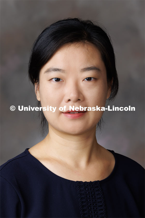 Studio portrait of Jing Wang, Assistant Professor, Special Education and Communication Disorders. September 27, 2023. Photo by Craig Chandler / University Communication.