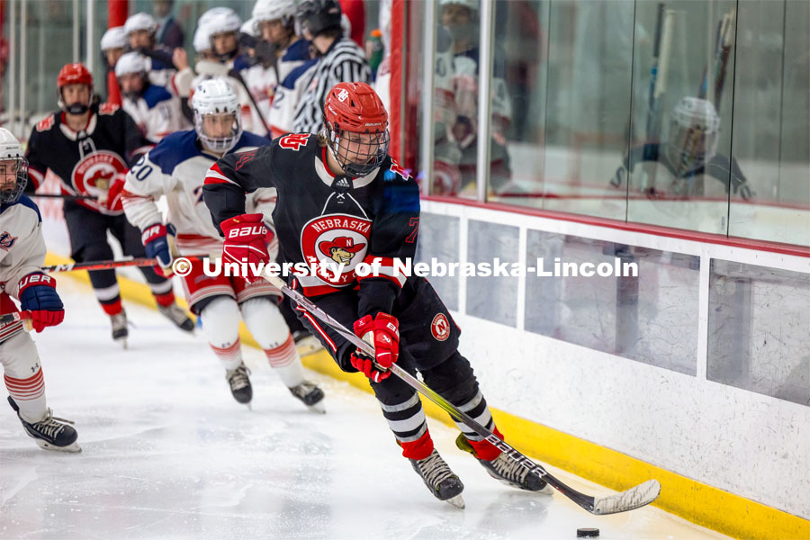 Dylan Mcrae Forward #74 moves the puck down the ice. Husker Hockey at Breslow Ice Hockey Center. October 7, 2023. Photo by Dillon Galloway for University Communication and Marketing.
