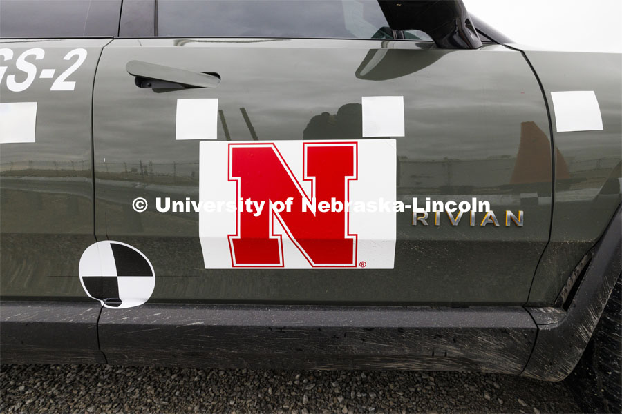 The Rivian truck has decals affixed to the sides and top to make it easier for the data to be used that the cameras capture. In research sponsored by the U.S. Army Engineer Research and Development Center, the University of Nebraska-Lincoln’s Midwest Roadside Safety Facility is investigating the safety and military defense questions raised by the burgeoning number of electric vehicles on the nation’s roadways. crash test performed on a guardrail on October 12, 2023, highlighted the concern. At 60 mph, the 7,000-plus-pound, 2022 Rivian R1T truck tore through a commonly used guardrail system with little reduction in speed. October 12, 2023. Photo by Craig Chandler / University Communication and Marketing.