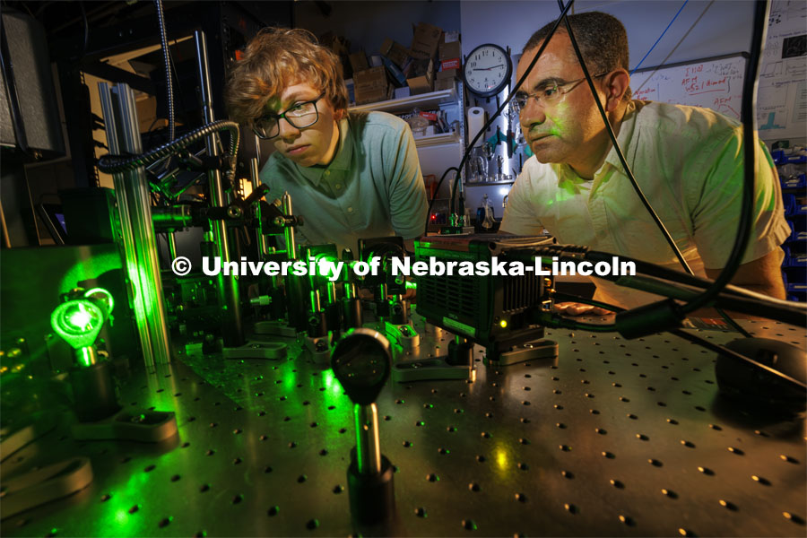 Ben Hammons, a freshman in electrical engineering, and Abdelghani Laraoui, Assistant Professor in Mechanical and Materials Engineering, work on their laser equipment. Laraoui is working to find materials that would improve the performance of quantum computing. To do this, they need to create an environment that is super cold – talking close to zero Kelvin. Laraoui said the NSF money, in part, is helping to fund the purchase of a state-of-the-art MRI that creates such cold environments. It would make UNL one of the few places in the US that this type of research could take place. October 12, 2023. Photo by Craig Chandler / University Communication.