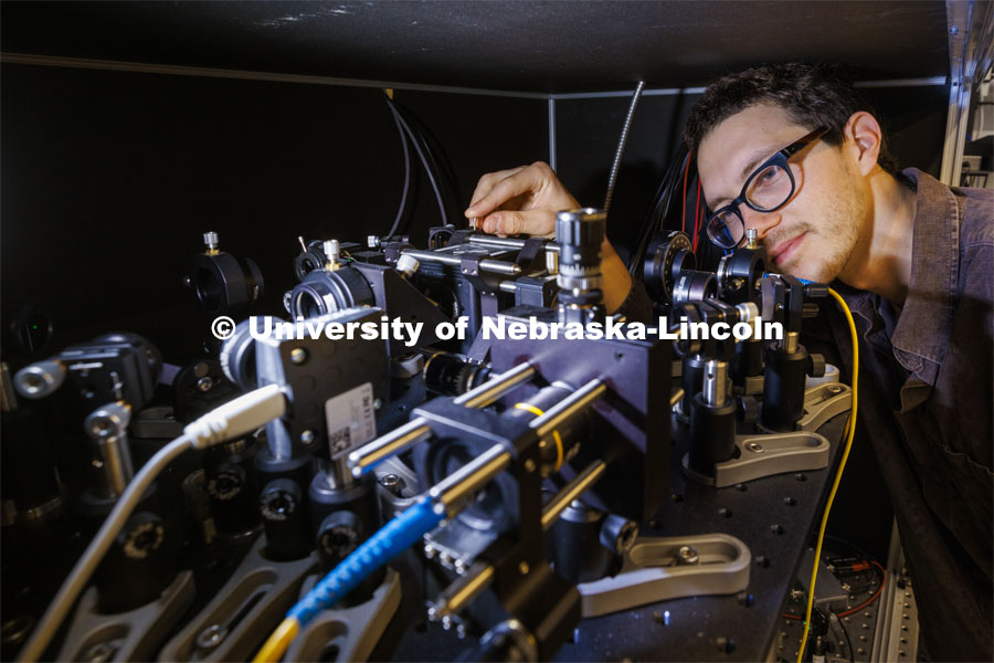 Adam Erickson, graduate student in engineering, works with his laser experiment in the Laraoui lab. Abdelghani Laraoui, is working to find materials that would improve the performance of quantum computing. To do this, they need to create an environment that is super cold – talking close to zero Kelvin. Laraoui said the NSF money, in part, is helping to fund the purchase of a state-of-the-art MRI that creates such cold environments. It would make UNL one of the few places in the US that this type of research could take place. October 12, 2023. Photo by Craig Chandler / University Communication.