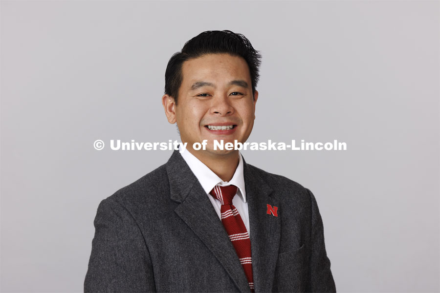 Studio portrait of Khoi Tran, Associate Director for the Office of Admissions. October 19, 2023. Photo by Craig Chandler / University Communication.