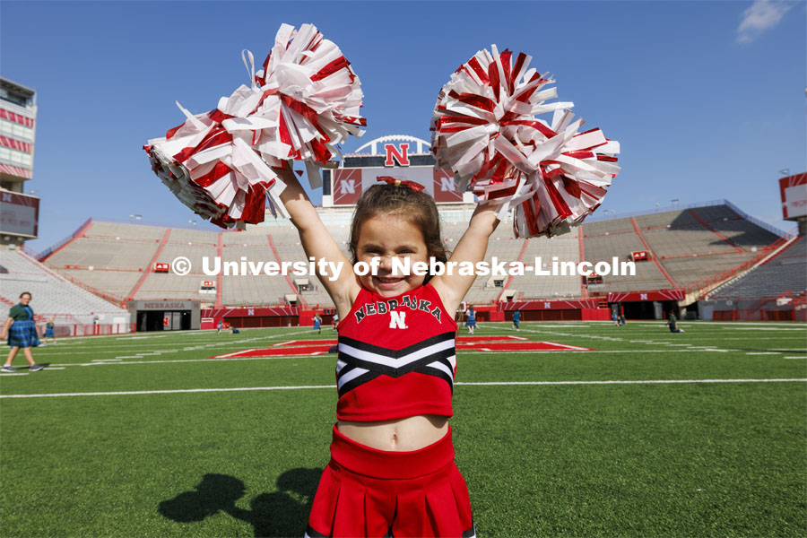 Zoey Nickel, 3, came to help cheer for the Memorial Stadium 100th birthday party at the stadium. The free public event featured cake and visitors could walk onto the field. October 23, 2023. Photo by Craig Chandler / University Communication.