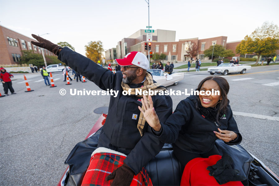 Chancellor Rodney Bennett and his wife, Temple, wave to the crowd as the parade turns onto 14th Street to go to Memorial Stadium. Homecoming parade and Cornstock. October 27, 2023. Photo by Craig Chandler / University Communication.