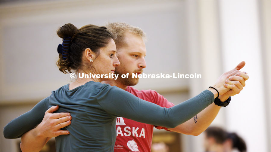Cassia Ruhl and Harry Endrulat perform a tango. Ballroom Dancing Club works through their final practice in the Nebraska Union Ballroom Thursday night before Saturday’s show. December 7, 2023. Photo by Craig Chandler / University Communication and Marketing.