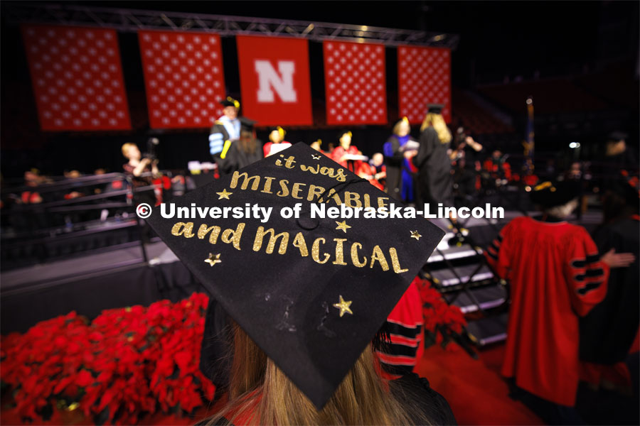 Elisa Stoike summed up her CEHS college highs and lows on her mortar board. Winter undergraduate commencement in Pinnacle Bank Arena. December 16, 2023. Photo by Craig Chandler / University Communication and Marketing.