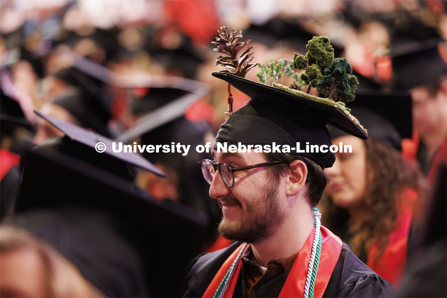 Jacob Hillis decorated his mortar board to celebrate his horticulture degree. Winter undergraduate commencement in Pinnacle Bank Arena. December 16, 2023. Photo by Craig Chandler / University Communication and Marketing.