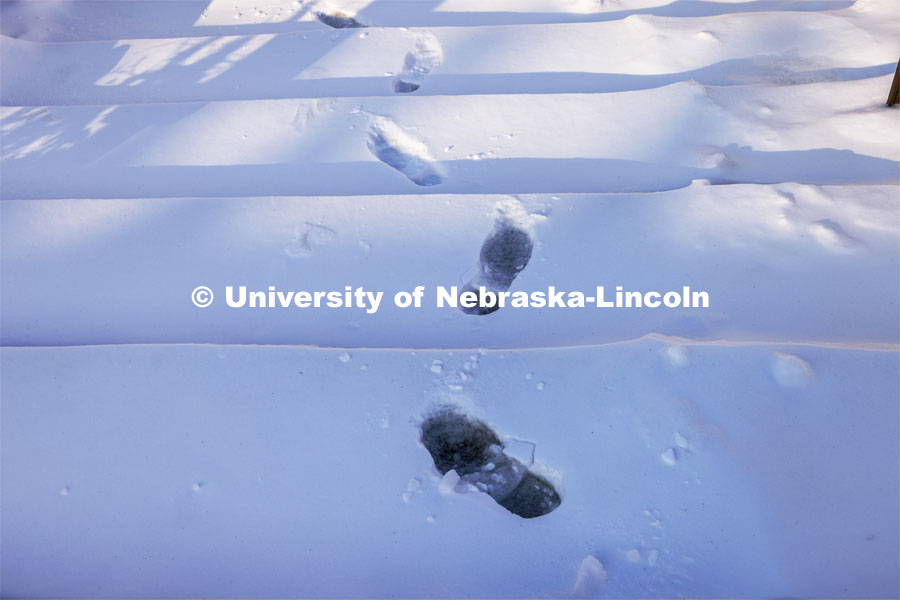Footprints in the snow. Snow on city campus. January 9, 2024. Photo by Craig Chandler / University Communication and Marketing.