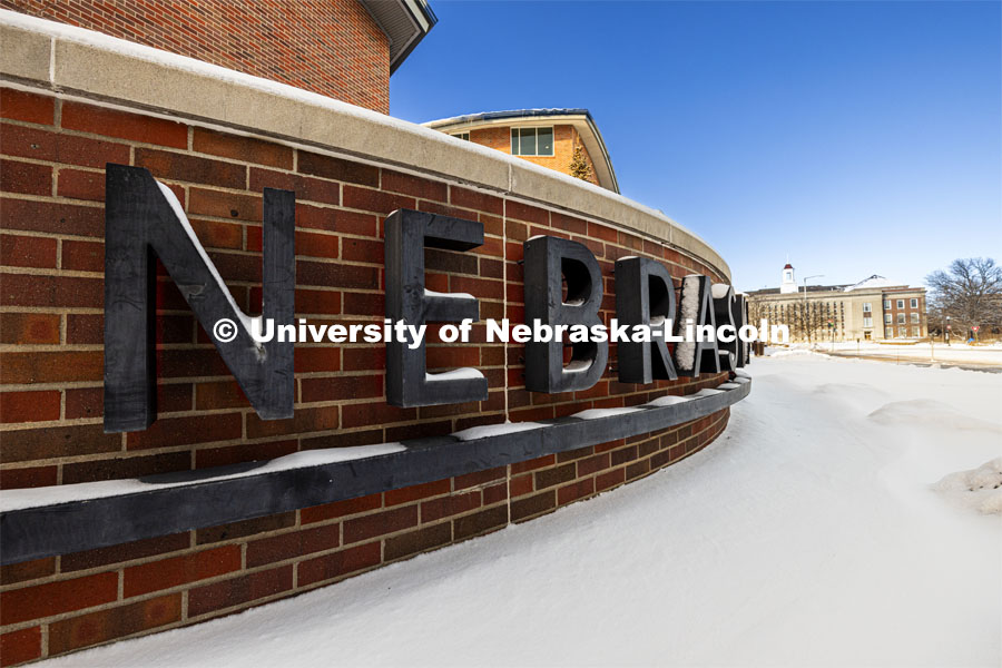 Van Brunt Visitors Center Nebraska sign covered in snow. Snow on city campus. January 9, 2024. Photo by Craig Chandler / University Communication and Marketing.