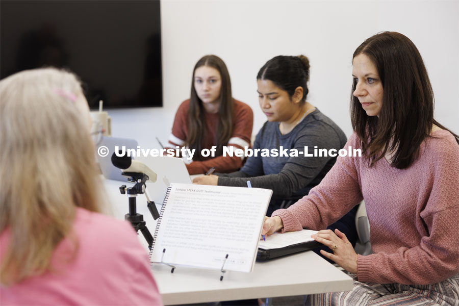 Jessie Kohn (right), Lecturer in Special Education and Communication Disorders, watches and records the voices levels as Rhonda Heiserman of Lincoln, during her clinic session. Graduate students Claire Streeter, left, and Nayeli Cruz takes notes. Parkinson Voice Project. February 6, 2024. Photo by Craig Chandler / University Communication and Marketing.