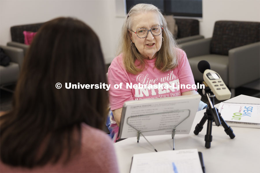 Rhonda Heiserman of Lincoln reads out loud during her clinic session. The instrument measures the decibels of Heiserman’s speech. Parkinson Voice Project. February 6, 2024. Photo by Craig Chandler / University Communication and Marketing.