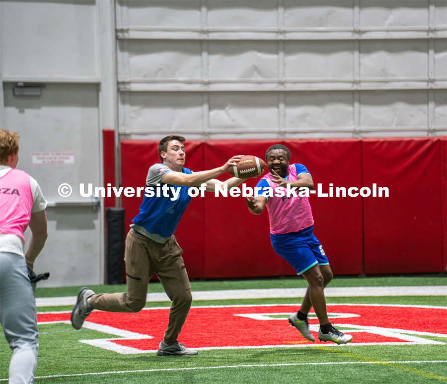 University of Nebraska-Lincoln student Luke Walker intercepts the ball from Professor Jean Marcel Ngoko Djiokap at Cook Pavilion Field. Nebraska’s Jean Marcel Ngoko Djiokap is taking physics lessons from the lectern to athletic fields to connect with students. February 9, 2024. Photo by Kirk Rangel / University Communication.