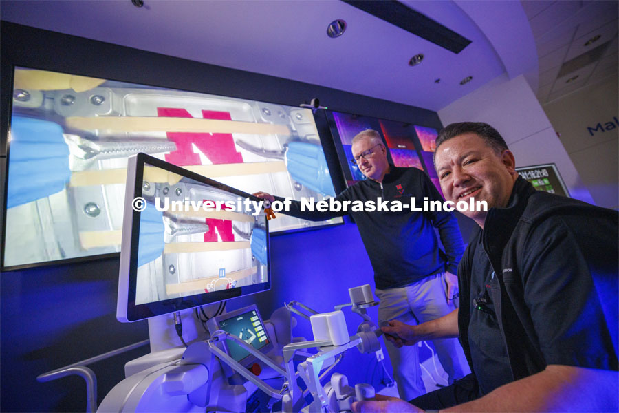 Nebraska Engineering professor and Virtual Incision co-founder Shane Farritor watches as Dr. Michael Jobst, a colorectal surgery specialist in Lincoln, makes the first surgical robotic cut on the International Space Station. Using controls at the Virtual Incision offices in Lincoln, surgeons cut rubber bands — mimicking surgery inside a payload box on the International Space Station. February 10, 2024. Photo by Craig Chandler / University Communication and Marketing.