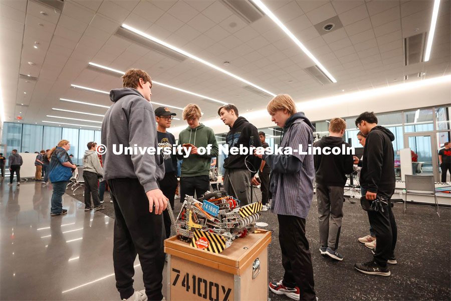 Concordia Junior/Senior High School Robotics team, run by Matthew Mueller, preparing their bot before a match. 2024 VEX Robotics Outreach Tournament hosted in Kiewit Hall. February 10, 2024. Photo by Taryn Hamill for University Communication and Marketing.