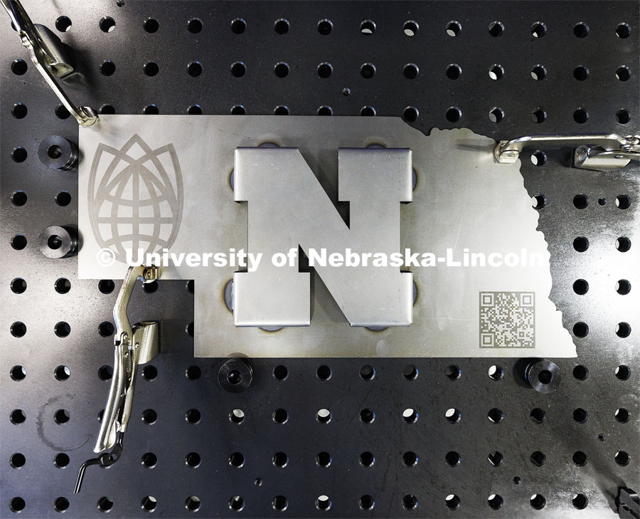 A metal sculpture that the robotic arm welded raised “N”. Nebraska Innovation Studio is working with robotic arms and teaching students and local industry people how to use them. February 20, 2024. Photo by Craig Chandler / University Communication and Marketing.