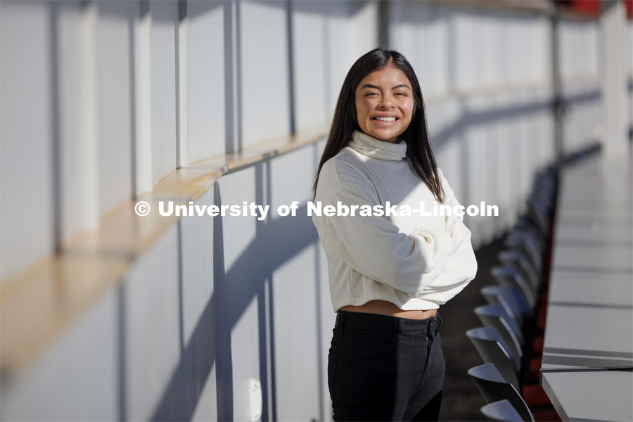 Marissa Kraus, a senior in journalism, poses for a picture in the media box in Memorial Stadium. As a sportswriter, she spent much of her college career covering the Huskers. For Women’s History Month story. February 20, 2023. Photo by Craig Chandler / University Communication and Marketing.