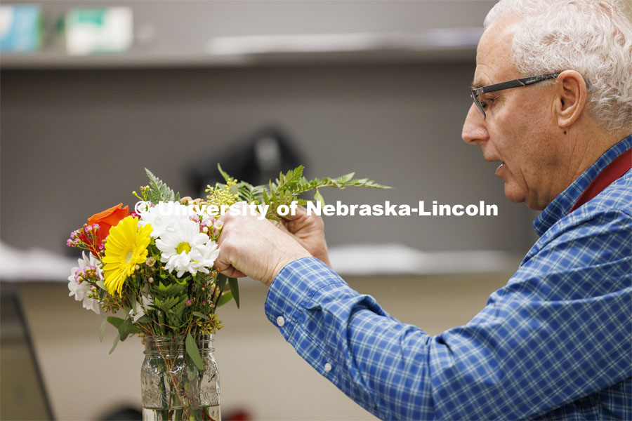 Professor Stacy Adams designs a bouquet like the ones the students will build in PLAS 261 - Floral Design I in the Plant Science Building. February 21, 2024. Photo by Craig Chandler / University Communication and Marketing.