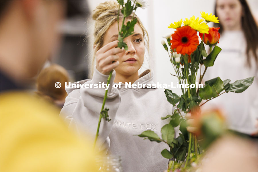 Emily Boyle, a senior Speech-Language Pathologist student designs her bouquet in PLAS 261 - Floral Design I in the Plant Science Building. February 21, 2024. Photo by Craig Chandler / University Communication and Marketing