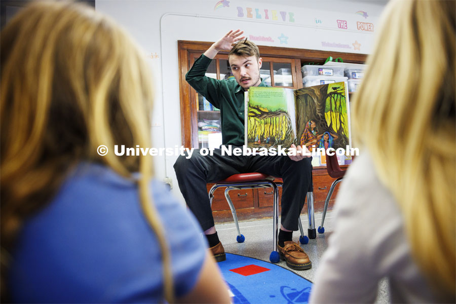 Jack Hilgert, Conservation Education Coordinator for the Nebraska Forest Service, reads a book about trees to second graders about trees at Humboldt-Table Rock-Steinauer school in Humboldt, Nebraska. Each student was given a Colorado blue spruce seedling to raise in the classroom while they learn about trees. March 25, 2024. Photo by Craig Chandler / University Communication and Marketing.