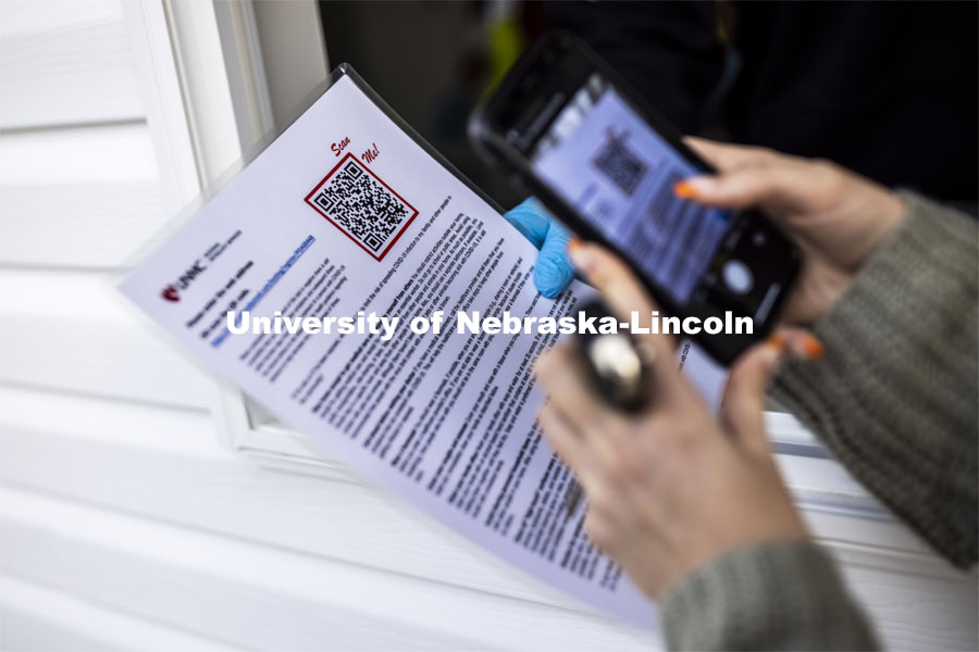 201118_Testing_029.jpg A QR code is scanned so the walk up person can sign in for testing. Participants in COVID testing at