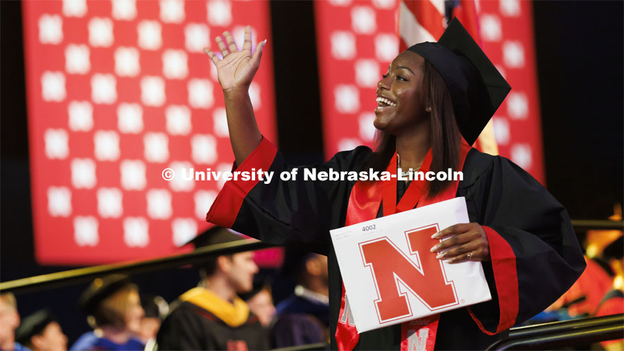 220813_Summer_Commencement_1382.jpg Nailah Dillard waves to family and friends after receiving her degree. Nebraska grants about 600 deg