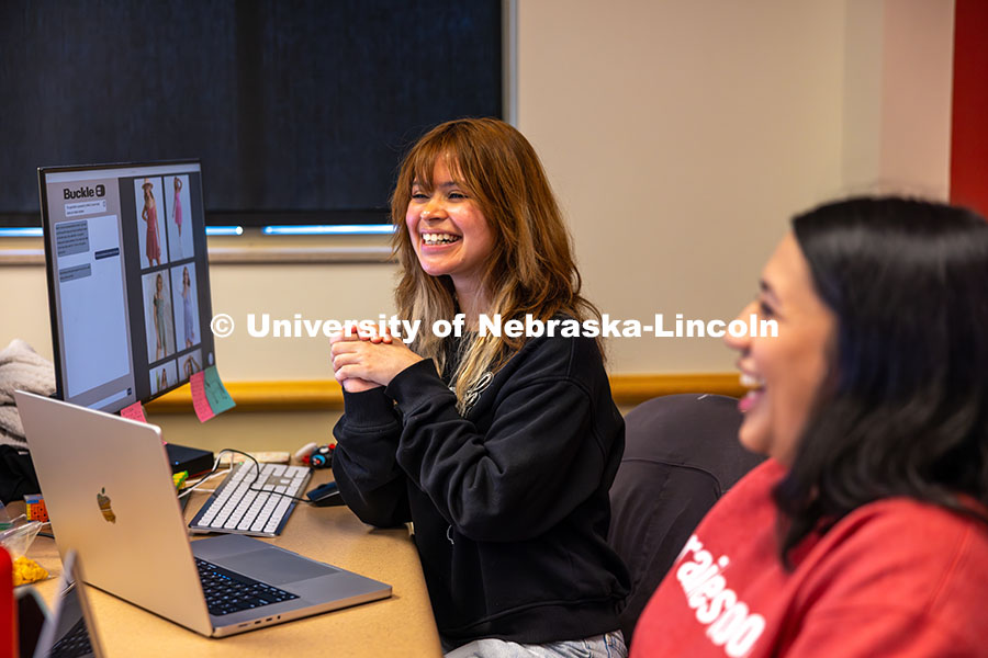 250414_Raikes_7.jpg Katia Henrriquez smiles as her and the Design Studio team work on their AI program for Nebraska-base