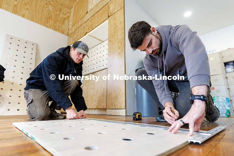 241209_Art_Chapel_03.jpg Third year architecture students Devyn Beekman, right, and Ethan Watermeier measure what they will c
