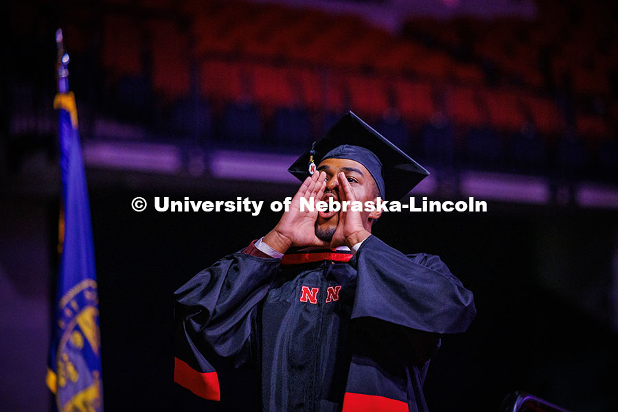 250516_Grad_Commencement_0770.jpg COJMC Graduate student, Jordan Ambrose, yells back to his family members in the crowd at Graduate Co