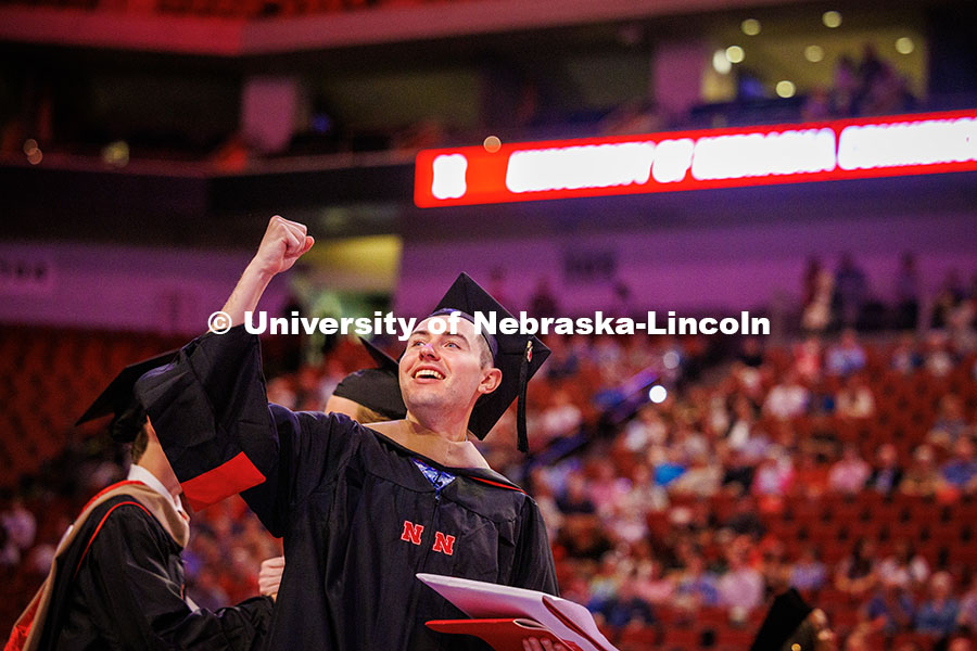 Accountancy graduate student, Connor Morrissey, fist pumps the air on his way out of the Graduate Co