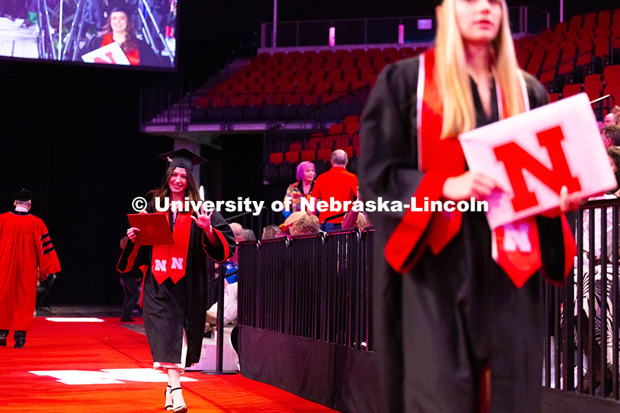 250517_Commencement_2406.jpg College of Arts and Sciences graduate, Jasmine Amaya, waves toward the camera after receiving her di