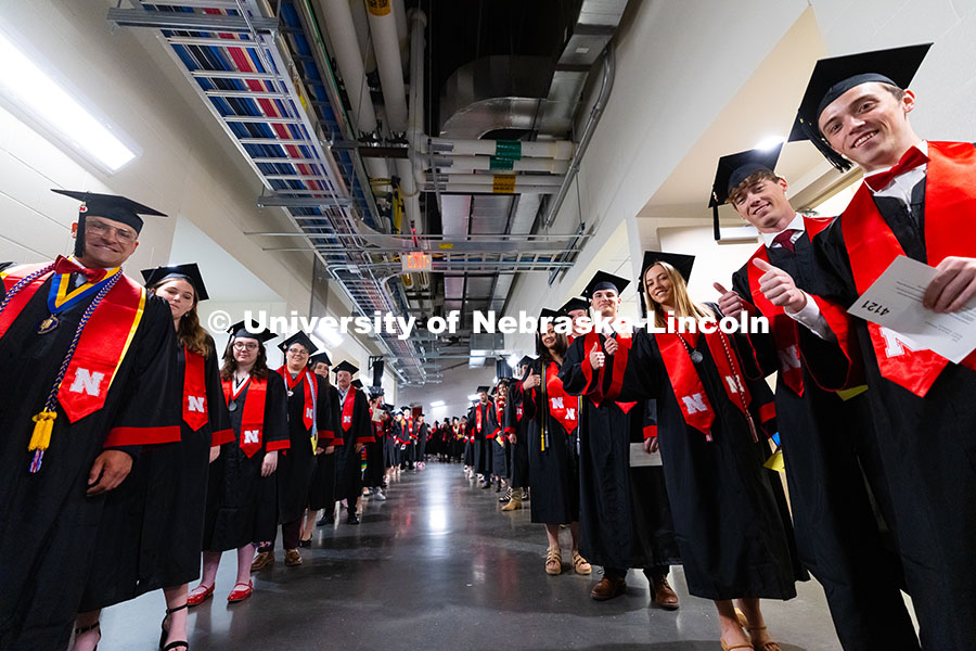 250517_Commencement_7765.jpg Graduates pose as they line up for the processional into Pinnacle Bank Arena for the University of N