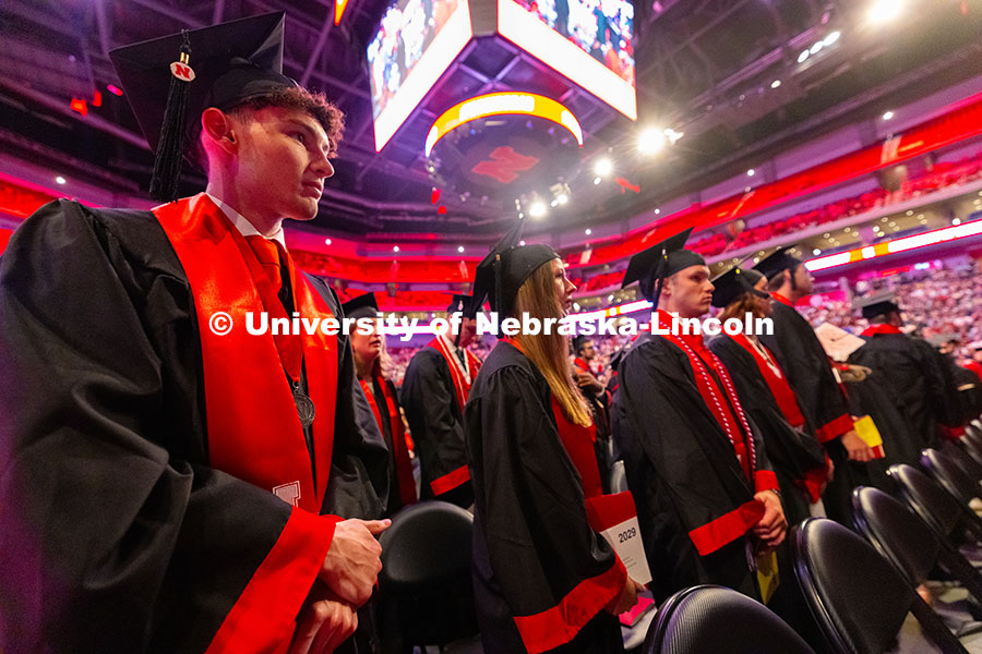 250517_Commencement_7841.jpg Gwyer Leach looks toward the podium in Pinnacle Bank Arena as he waits to receive his diploma. Leach