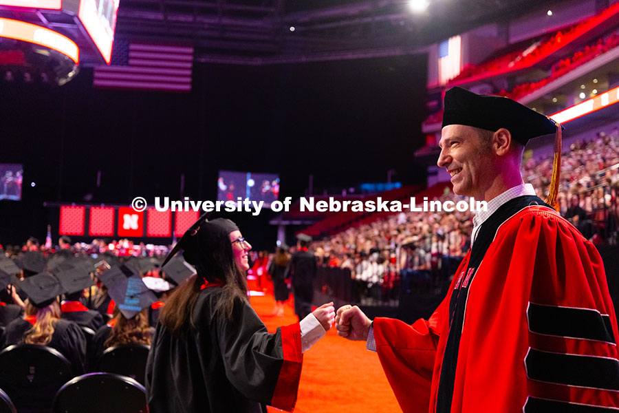 250517_Commencement_7905.jpg Kenneth Pyle handed out fist bumps, thumbs-ups and hugs to students he advised in the Fisheries and