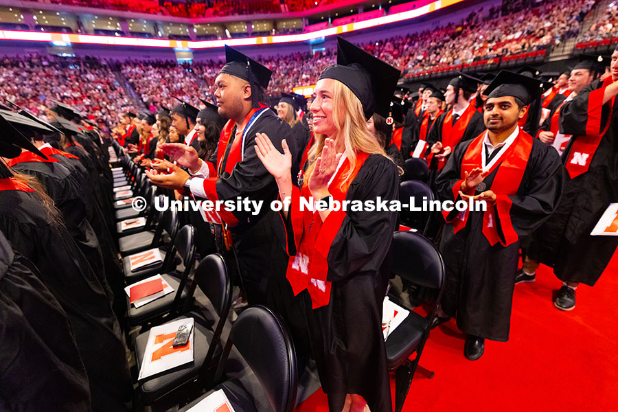 250517_Commencement_8095.jpg Business Administration graduate Emily Nau claps at the end of the University of Nebraska–Lincoln'