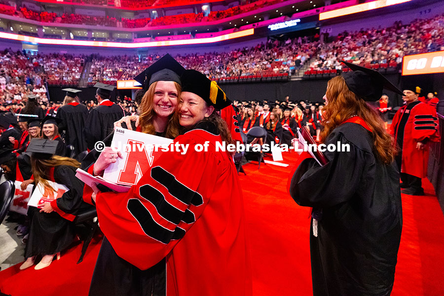 250517_Commencement_8436.jpg Dr. Kim Hansen hugs Alyssa Vetere, who served as a teaching assistant in Hansen's human physiology c