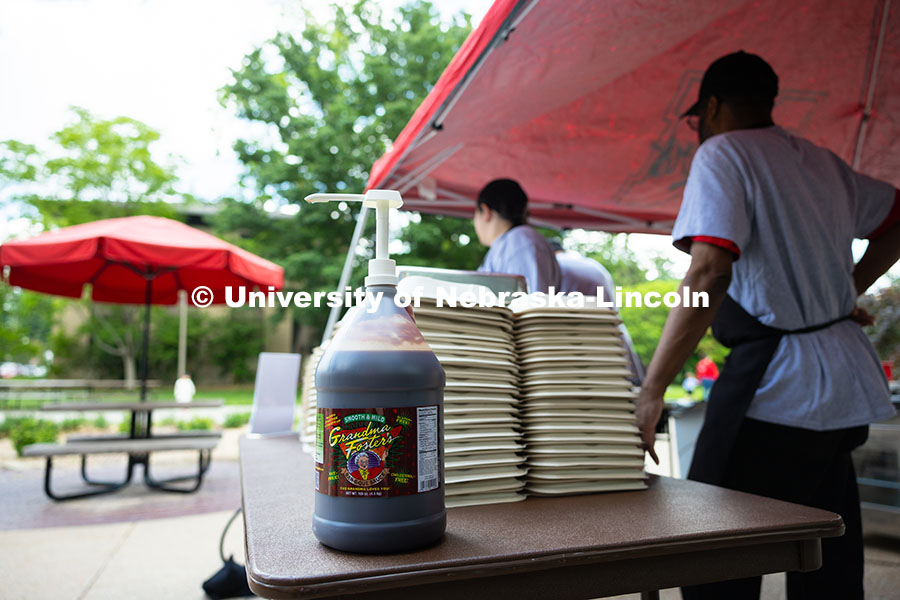 250529_Grill_Out_9303.jpg A jug of Grandma Foster's mild barbecue sauce is ready for customers at the East Campus Dining Servi