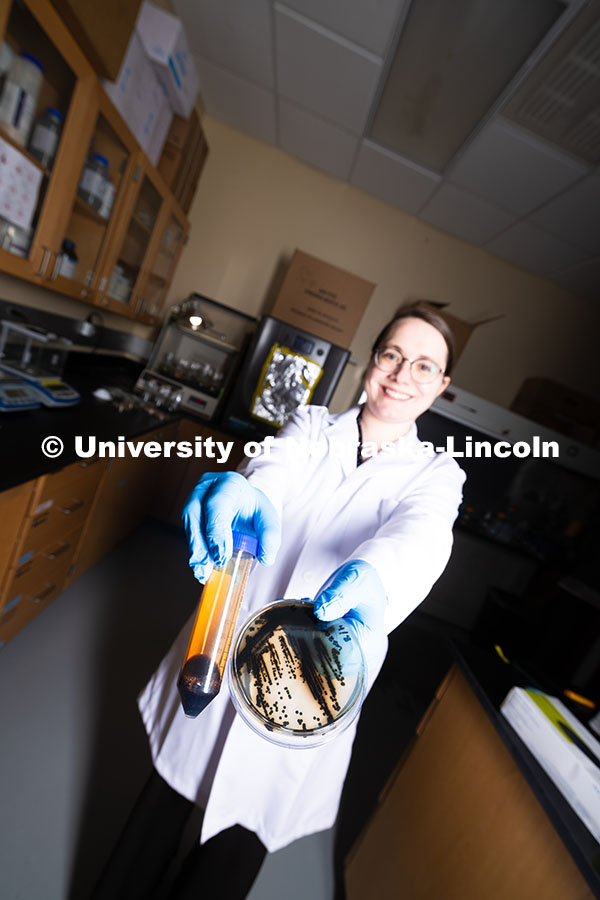 250618_Erin_Carr_541.jpg Erin Carr, a postdoctoral research associate in chemical and biomolecular engineering, holds up a pe