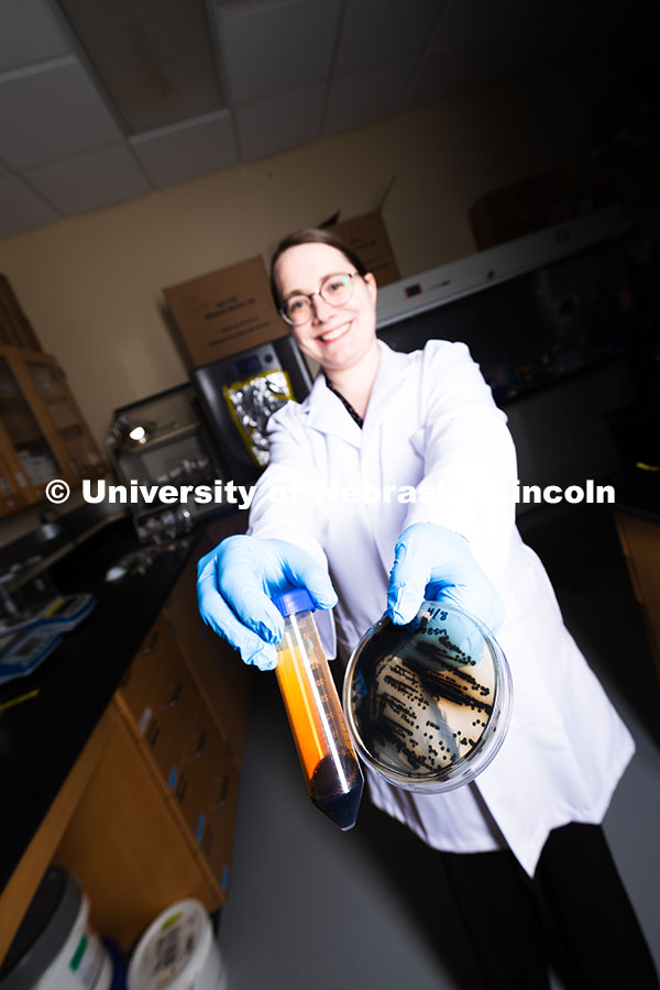 250618_Erin_Carr_542.jpg Erin Carr, a postdoctoral research associate in chemical and biomolecular engineering, holds up a pe