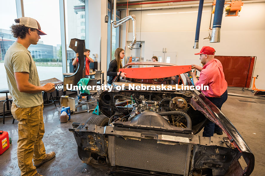 250623_Engineering_1774.jpg The UNL Figure 8 Racing Team attaches the dashboard to their 1980 Pontiac Firebird inside the Kiewit
