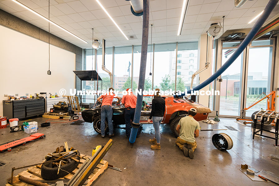 250623_Engineering_1845.jpg Members of the UNL Figure 8 Racing Team work on finishing touches inside the Kiewitt Hall Garage bef