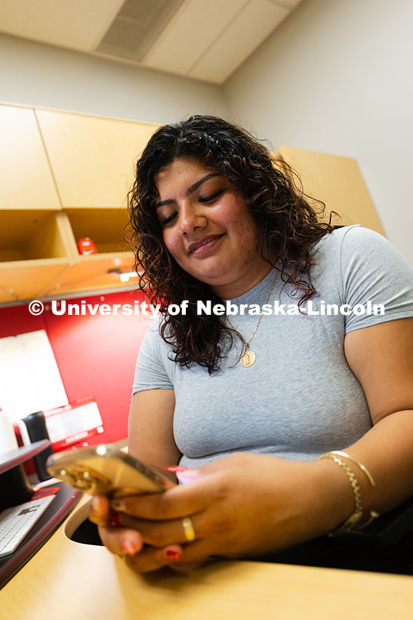 Academic navigators, like Josselyn Vazquez-Catalan, can communicate with students through text messa
