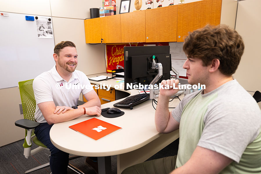 250624_Navigators_0944.jpg Adam Christiansen, Academic Navigator in the Explore Center, speaks with Jacob Behnk, a senior study